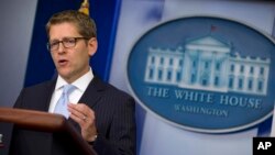 White House press secretary Jay Carney gestures during the daily press briefing at the White House, Aug. 26, 2013.