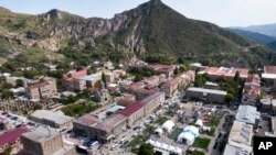 An aerial view of Goris with the tent camp for Ethnic Armenians from Nagorno-Karabakh arriving to Armenia in Syunik region, Armenia, Friday, Sept. 29, 2023. 