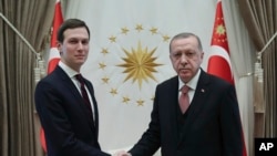 Turkey's President Recep Tayyip Erdogan shakes hands with Jared Kushner (L), U.S. President Donald Trump's adviser, prior to their meeting at the Presidential Palace in Ankara, Turkey, Feb. 27, 2019. 