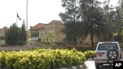 A car drives past the Iranian Embassy in Abuja, Nigeria, Friday, Nov. 12, 2010. Nigeria will take actions against Iran if an investigation shows it violated international law and U.N. sanctions in an arms smuggling case, Nigeria's foreign minister said Fr