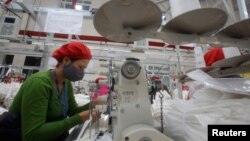A woman works at a garment factory in Hai Duong province in Vietnam. The Southeast Asian nation hopes to increase trade after the collapse of the Trans-Pacific Partnership free trade agreement.