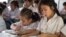 FILE - Primary students are reading during a classroom session at Kesararam primary school, in Siem Reap province, on Friday, March 20, 2015. (Nov Povleakhena/VOA Khmer)