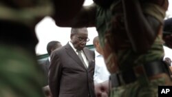 An official of the Independent National Electoral Commission retrieves documents from ballot boxes from the presidential election in Katsina state, March 29, 2015. 