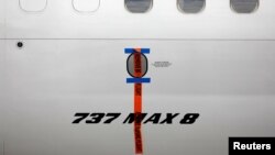 FILE - A seal is seen on Garuda Indonesia's Boeing 737 Max 8 airplane parked at the Garuda Maintenance Facility AeroAsia, at Soekarno-Hatta International airport near Jakarta, Indonesia, March 13, 2019.