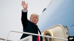 President Donald Trump boards Air Force One at Andrews Air Force Base, Maryland, Jan. 8, 2018, to travel to Nashville, Tennessee, to speak at the American Farm Bureau Federation's Annual Convention. 