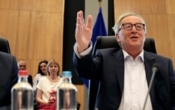 FILE - European Commission President Jean-Claude Juncker chairs a meeting of the college of commissioners at EU headquarters in Brussels, July 24, 2019.