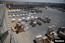 Packages of goods are seen ahead of their transfer to the Gaza Strip, inside the Kerem Shalom border crossing terminal between Israel and Gaza Strip, Israel, Aug. 15, 2018.