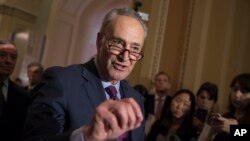 FILE - Senate Minority Leader Charles Schumer, D-N.Y., reacts to questions from reporters about President Donald Trump's reported sharing of classified information with two Russian diplomats during a meeting in the Oval Office, May 16, 2017, on Capitol Hill in Washington.