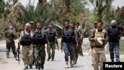 Des combattants shiites se rassemblant près de Fallouja, Irak, le 4 juin 2016. ( REUTERS/Thaier Al-Sudani )