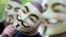 Activists of the international network "Anonymous" behind their masks posing in Berlin. 