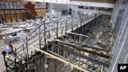 Israeli police officers walk inside an empty synagogue is seen in Givat Zeev, outside Jerusalem, May 16, 2021. 