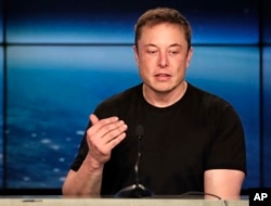 FILE- In this Feb. 6, 2018, photo, Elon Musk, speaks at a news conference after the Falcon 9 SpaceX heavy rocket launched successfully from the Kennedy Space Center in Cape Canaveral, Florida.