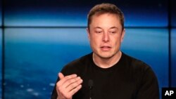 FILE - In this Feb. 6, 2018, photo, Elon Musk, founder, CEO of SpaceX and CEO of Tesla Inc., speaks at a news conference after the Falcon 9 SpaceX heavy rocket launched successfully from the Kennedy Space Center in Cape Canaveral, Florida.