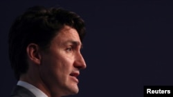 特鲁多2018年12月1日出席一场记者会（路透社）