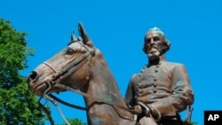 FILE - A statue of Confederate Gen. Nathan Bedford Forrest sits in a park in Memphis, Tenn., Aug. 18, 2017.