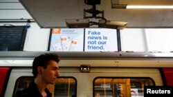 A Facebook billboard advertisement can be seen at Earls Court underground station in London, July 28, 2018.