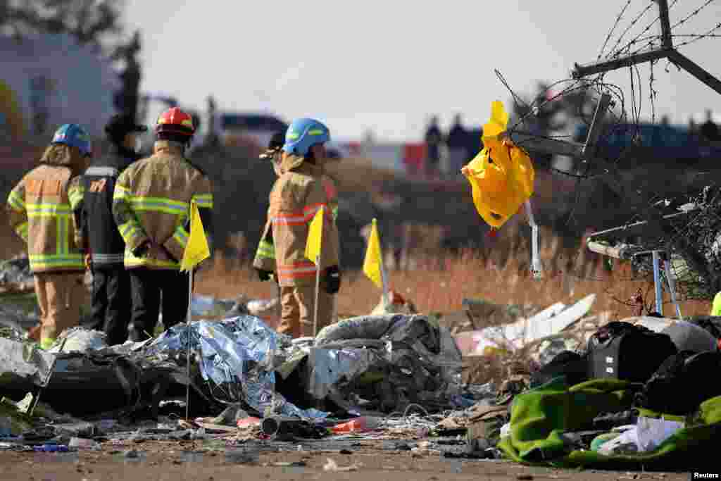 A life jacket hangs on fencing next to the wreckage of the aircraft at Muan International Airport, Dec. 29, 2024.&nbsp;