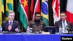 U.S. Secretary of State Antony Blinken speaks beside Guyana President Irfaan Ali and Jamaican Prime Minister Andrew Holness at an emergency meeting on Haiti at the Conference of Heads of Government of the Caribbean Community (CARICOM) in Kingston, Jamaica, March 11, 2024. 