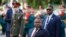 President of Mozambique Filipe Nyusi, centre, attends a wreath laying ceremony at the Tomb of the Unknown Soldier in Moscow, Russia, Wednesday, Aug. 21, 2019.