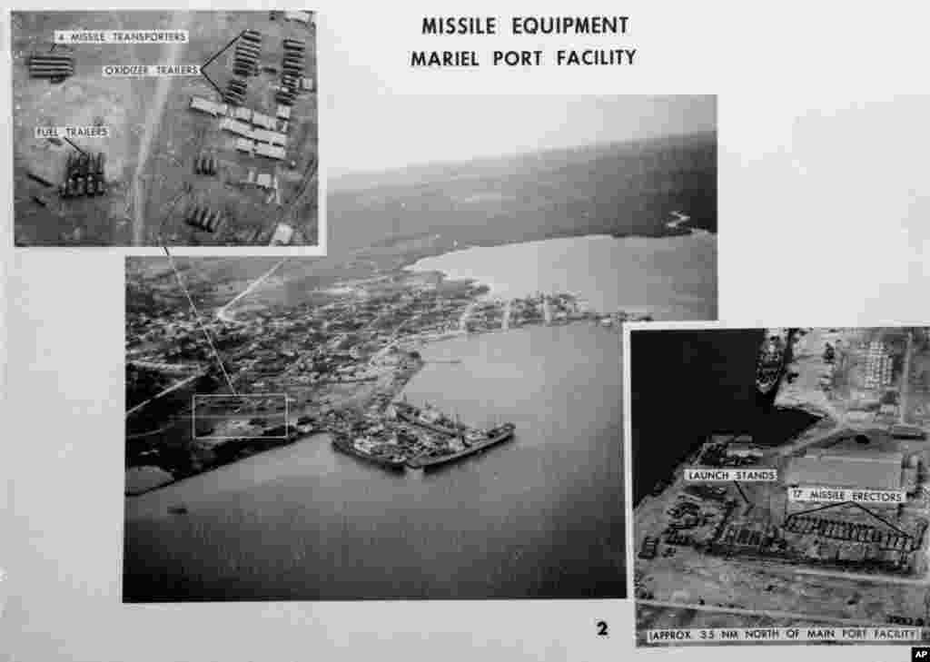 This file photo shows pictures released by the U.S.Defense Department of Mariel naval port in Cuba on November 4, 1962.&nbsp; The department identified the ships at dockside as Soviet freighters. Photo at upper left is a blowup of missile equipment in outline
