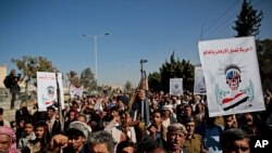Houthi supporters chant slogans during a rally outside the closed U.S. embassy over obver the decision of the Trump administration to designate the Houthis a foreign terrorist organisation, in Sana'a, Yemen, Jan. 18, 2021.