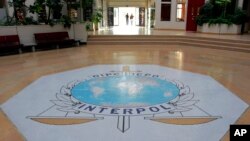 FILE - The entrance hall of Interpol's headquarters in Lyon, central France. 