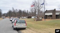 Authorities investigate the scene of school shooting, Tuesday, Jan 23, 2018, in Benton, Ky. Kentucky State Police said the suspect was apprehended by a Marshall County deputy.