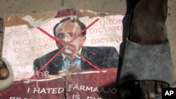Demonstrators from Somali anti-government opposition groups stand on photographs of the president in the Fagah area of Mogadishu, Somalia, April 25, 2021.