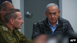 FILE - This screen grab taken from a handout video released by the Israeli government press office shows Prime Minister Benjamin Netanyahu attending a meeting in the command center of the defense ministry in Tel Aviv on Oct. 26, 2024.