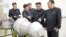North Korean leader Kim Jong Un, center, provides guidance on a nuclear weapons program in this undated photo released by North Korea's Korean Central News Agency (KCNA) in Pyongyang, Sept. 3, 2017.
