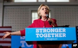FILE - A recent Associated Press investigation said more than half the people outside the government who met with Hillary Clinton — pictured above during a presidential campaign stop in Philadelphia in August 2016 — while she was secretary of state had given money, either personally or through companies or groups, to the Clinton Foundation. She has dismissed the report and other accusations of influence buying.