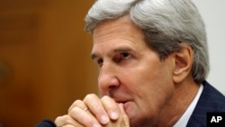 Secretary of State John Kerry waits to testify on Capitol Hill in Washington, Sept. 10, 2013, before the House Armed Services Committee hearing on Syria. 
