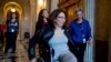 FILE - Sen. Tammy Duckworth, D-Ill. arrives for a closed-door Democratic policy luncheon on Capitol Hill in Washington.