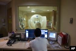 This 2015 file photo shows a PET scan being done on a patient at a hospital in Washington, D.C.