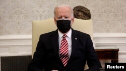 FILE - U.S. President Joe Biden hosts a meeting with labor leaders to discuss coronavirus response legislation and the president's infrastructure plan in the Oval Office at the White House in Washington.