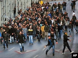 Kurds protest after Turkey's air force attacked suspected Kurdish rebel targets across the border in Iraq, killing dozens of people, many of them believed to be smugglers mistaken for PKK fighters, in Istanbul, Turkey, December 29. 2011.