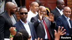 Jacob Zuma, former president of South Africa, waves to supporters outside the home of the late Winnie Mandela in Soweto, South Africa, April 4, 2018. Zuma appeared in court Friday to face corruption charges from the 1990s.