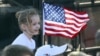 A young supporter flies a U.S. flag Feb. 28, 2016, at a rally in in Madison, Alabama, during the presidential candidates' final push to Super Tuesday.
