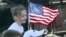 A young supporter flies a U.S. flag Feb. 28, 2016, at a rally in in Madison, Alabama, during the presidential candidates' final push to Super Tuesday.