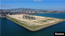 In this file photo, an empty shipping dock is seen, as the global outbreak of the coronavirus disease (COVID-19) continues, at the Port of Los Angeles, California, U.S., April 16, 2020. (REUTERS/Lucy Nicholson)