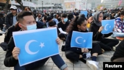 Gonkongliklar uyg'urlar huquqlarini himoya qilib namoyish o'tkazmoqda, 2019-yil, 22-dekabr