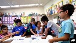 Second-graders are shown at Fryberger Elementary School in Westminster, Calif., on Thursday, Oct. 20, 2016. (AP Photo/Nick Ut)