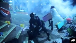 Police prepare to fire on protestors at the Hong Kong Polytechnic University in Hong Kong, Nov. 17, 2019. 