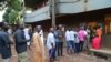 People queue to cast their votes during Presidential elections in Bambeto neighbourhood of Conakry, Guinea, Oct. 11, 2015.