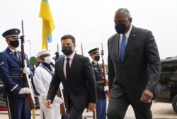 Ukrainian President Volodymyr Zelenskiy is welcomed by U.S. Defense Secretary Lloyd Austin at the Pentagon in Arlington, Virginia, Sept. 1, 2021.