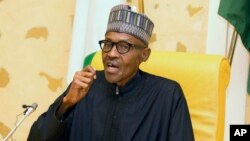In this photo released by the Nigeria State House, Nigeria President Muhammadu Buhari speaks at the presidential palace upon his arrival from medical vacation in Abuja, Nigeria, March 10, 2017. 