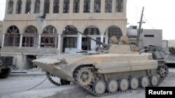 A tank belonging to the forces of Syria's President Bashar al-Assad is seen at Al-Sahl town, about 2km (a mile) to Yabroud's north, after the soldiers took control of it from the rebel fighters, March 3, 2014.