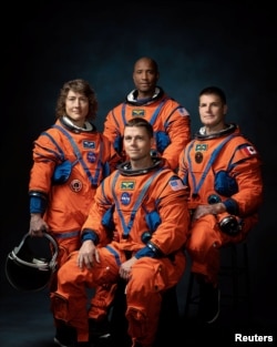 Four-member team chosen for the Artemis II lunar flyby pose at NASA Johnson Space Center