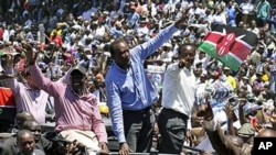 Kenya's former Education Minister William Ruto, center left, Kenya's Deputy Prime Minister Uhuru Kenyatta, center, and Kenya's Vice President Kalonzo Musyoka, center right, wave to thousands of people during a prayer rally at Uhuru Park, Kenya, April 11, 