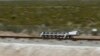 FILE - A sled speeds down a track during a test of a Hyperloop One propulsion system in North Las Vegas, Nevada, May 11, 2016.